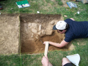 students digging in yard