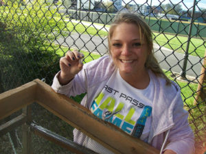 woman posing with artifact